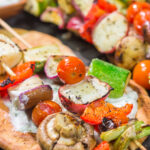 Take advantage of fresh summer produce with this Grilled Vegetable Souvlaki recipe. Serve with grilled pita and homemade tzatziki sauce for an extra boost of flavor!