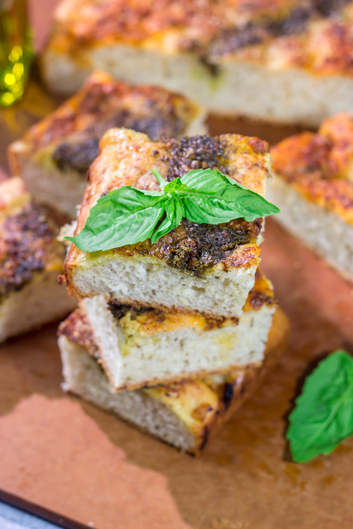 Topped with 2 types of pesto, this Sundried Tomato and Pesto Focaccia is a flavorful and delicious bread. Serve as a side dish or slice in half for a unique sandwich bread!
