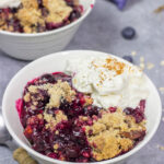 This classic Blueberry Crisp recipe features a juicy berry filling topped with a crispy oat streusel. It's the perfect dessert for warm summer evenings!