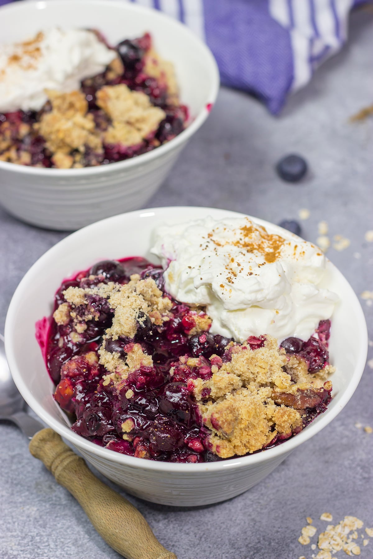 This classic Blueberry Crisp recipe features a juicy berry filling topped with a crispy oat streusel. It's the perfect dessert for warm summer evenings!