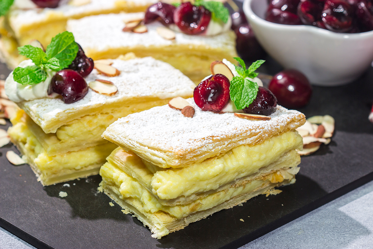 Filled with silky almond pastry cream and topped with juicy cherries, this Cherry Almond Napoleon is a fun twist on the classic French dessert!