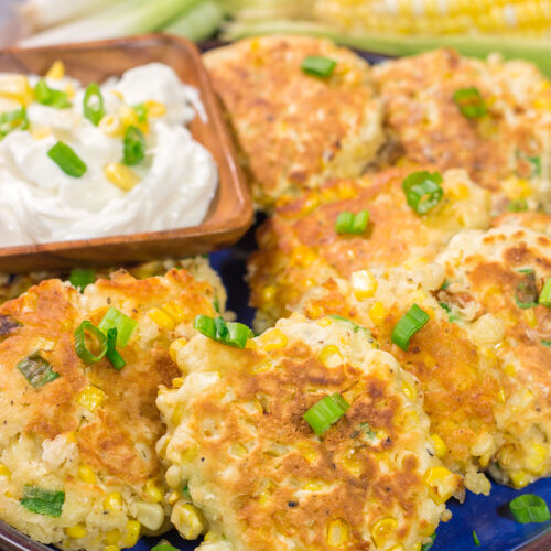 These Corn Fritters feature fresh corn kernels mixed into a simple batter. Serve with a side of sour cream for a delicious summer side dish or appetizer!