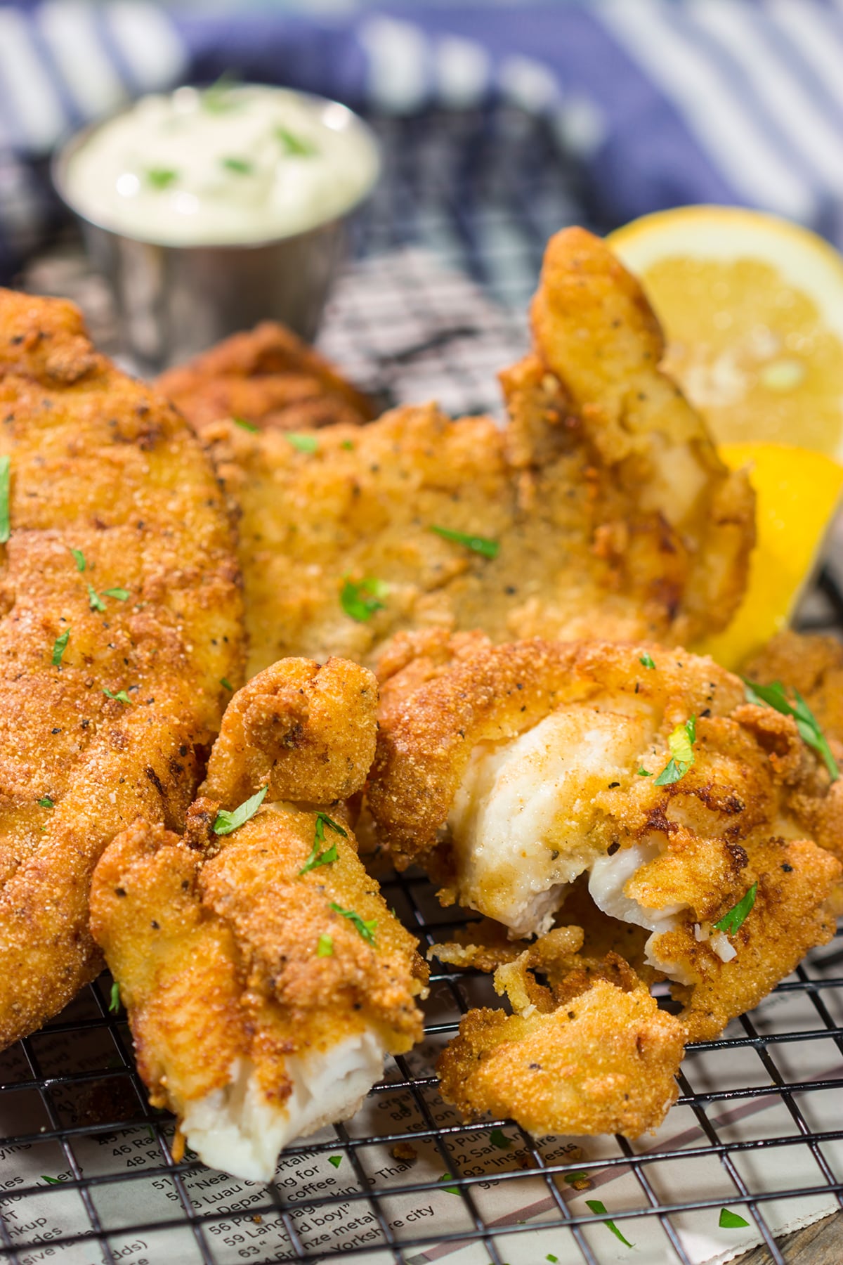 This Fried Catfish features a crispy cornmeal crust over tender catfish filets. Add in a squeeze of lemon and some homemade tartar sauce, and you've got a delicious fish fry recipe!