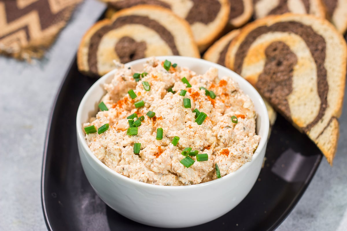 Liptauer is a tasty paprika-infused cheese spread popular throughout Austria, Hungary and Slovakia. This easy recipe is a great addition to an appetizer board!