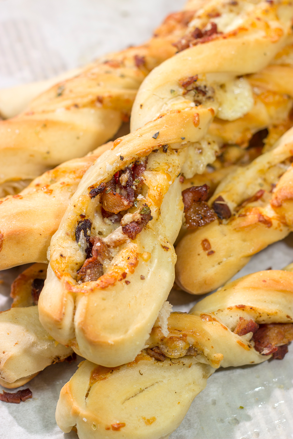 These Cheesy Bacon Breadsticks are proof that bacon and cheese make everything better! These breadsticks are great served as an appetizer or side dish. Enjoy!