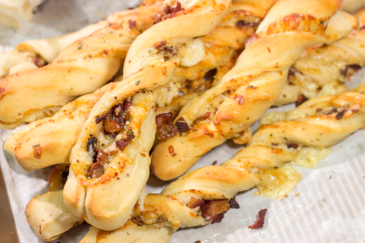 These Cheesy Bacon Breadsticks are proof that bacon and cheese make everything better! These breadsticks are great served as an appetizer or side dish. Enjoy!