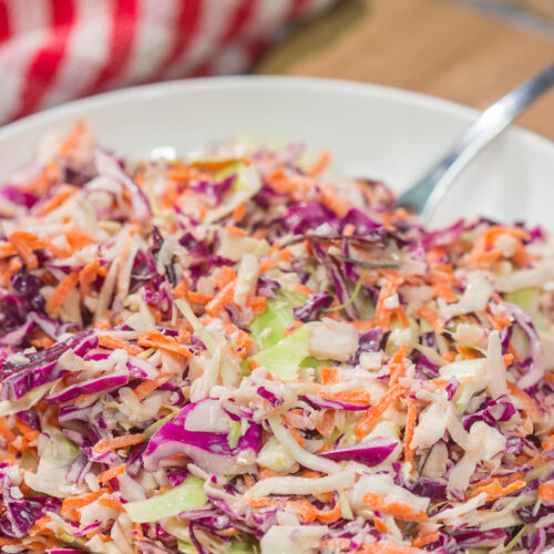 This Easy Coleslaw can be served as either a topping or a side dish. This creamy coleslaw recipe pairs well with barbecue, burgers and fried chicken.