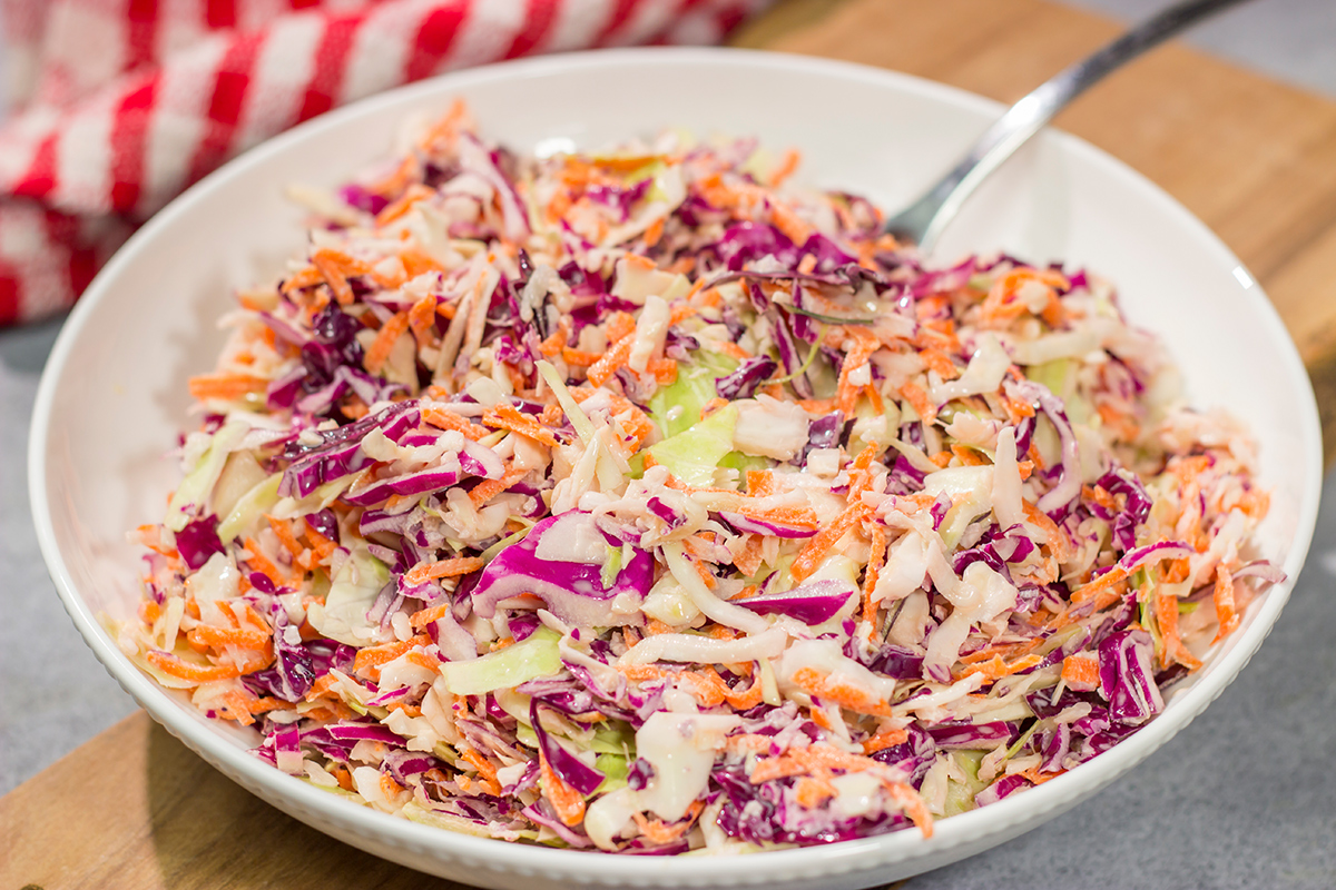 This Easy Coleslaw can be served as either a topping or a side dish. This creamy coleslaw recipe pairs well with barbecue, burgers and fried chicken.