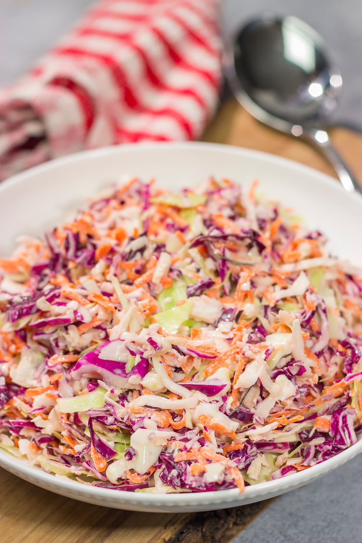 This Easy Coleslaw can be served as either a topping or a side dish. This creamy coleslaw recipe pairs well with barbecue, burgers and fried chicken.