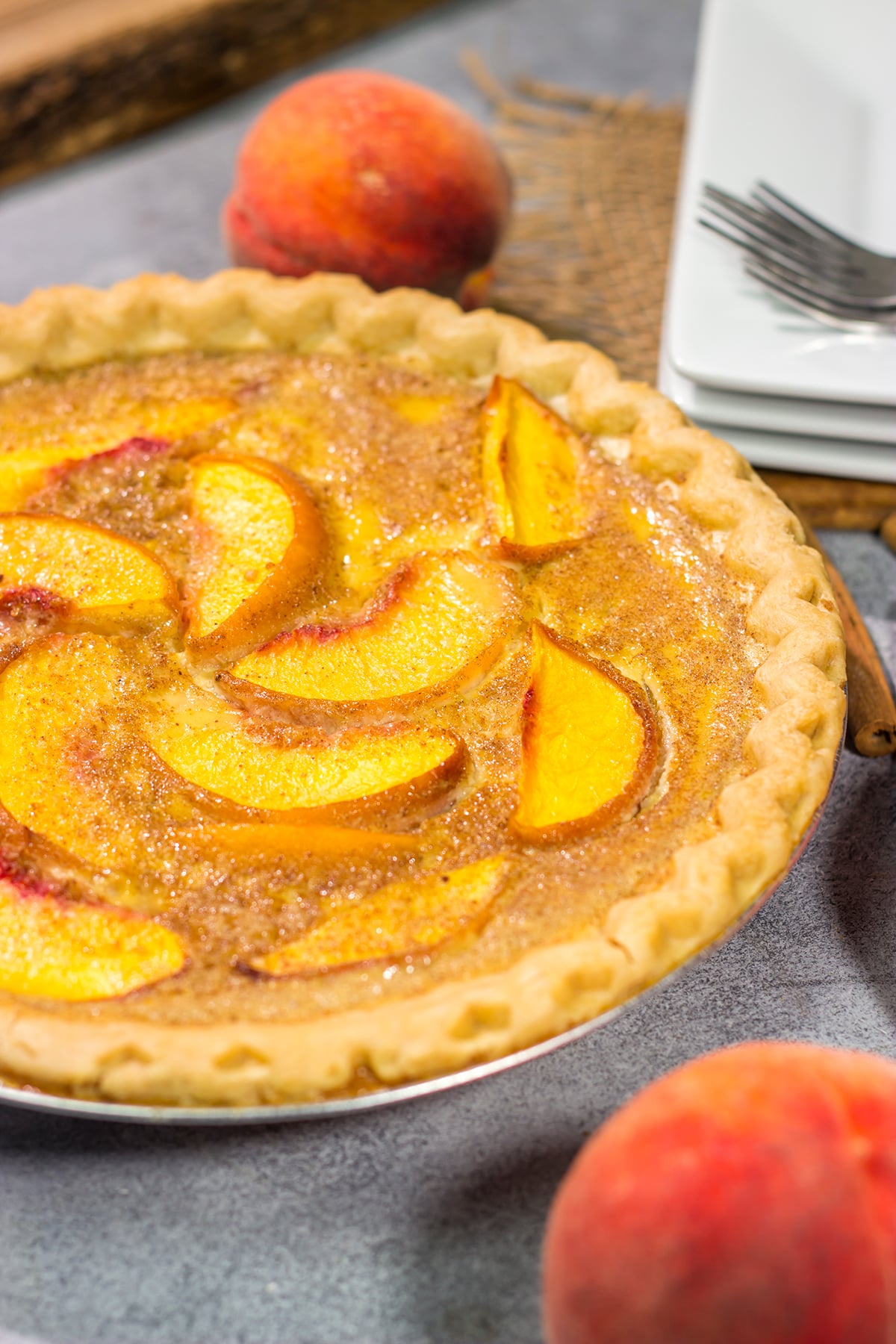 This Peaches and Cream Pie is a fun nod to the old-fashioned dessert of sliced peaches with fresh cream. The flavor of the fresh peaches makes this the perfect summer dessert recipe!
