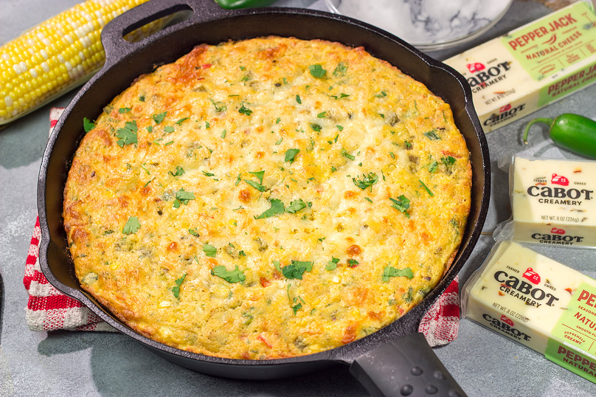 This easy Southwestern Cheesy Cornbread is packed with flavor! This tender cornbread is infused with bold Southwestern flavors - it's the perfect side dish for dinner tonight!