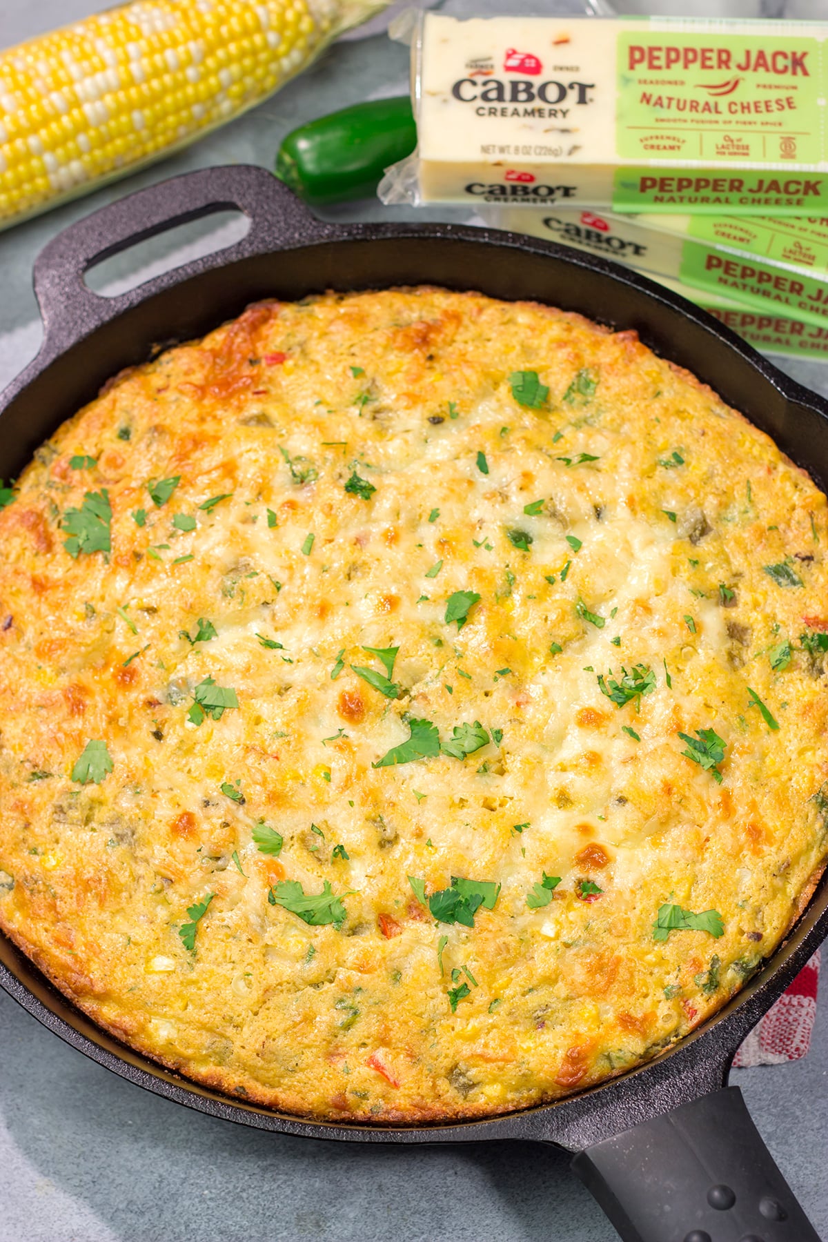 This easy Southwestern Cheesy Cornbread is packed with flavor! This tender cornbread is infused with bold Southwestern flavors - it's the perfect side dish for dinner tonight!
