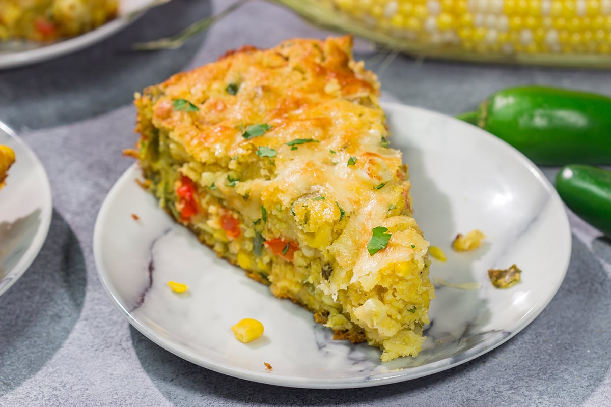This easy Southwestern Cheesy Cornbread is packed with flavor! This tender cornbread is infused with bold Southwestern flavors - it's the perfect side dish for dinner tonight!
