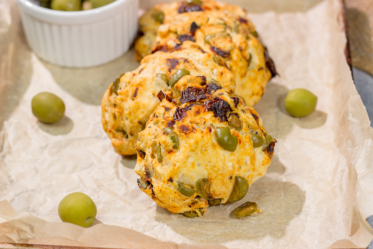 Put a savory spin on an old favorite! These Sundried Tomato and Olive Muffin Tops are packed with flavor. They're great next to a salad or a bowl of soup!