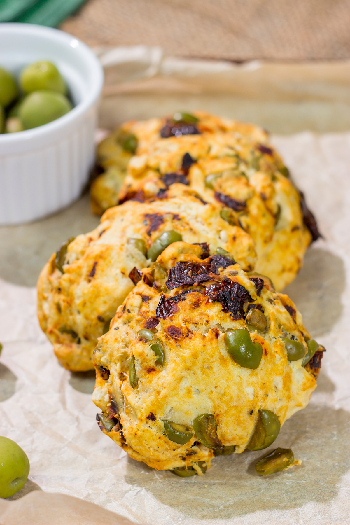 Put a savory spin on an old favorite! These Sundried Tomato and Olive Muffin Tops are packed with flavor. They're great next to a salad or a bowl of soup!