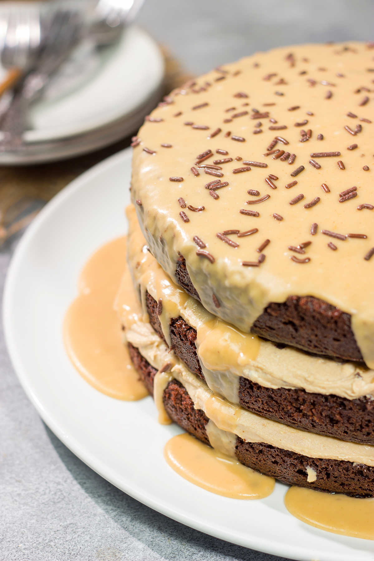 This Chocolate Cake with Peanut Butter Ganache features a chocolate layer cake filled with creamy peanut butter ganache. It's sure to be a new favorite dessert!