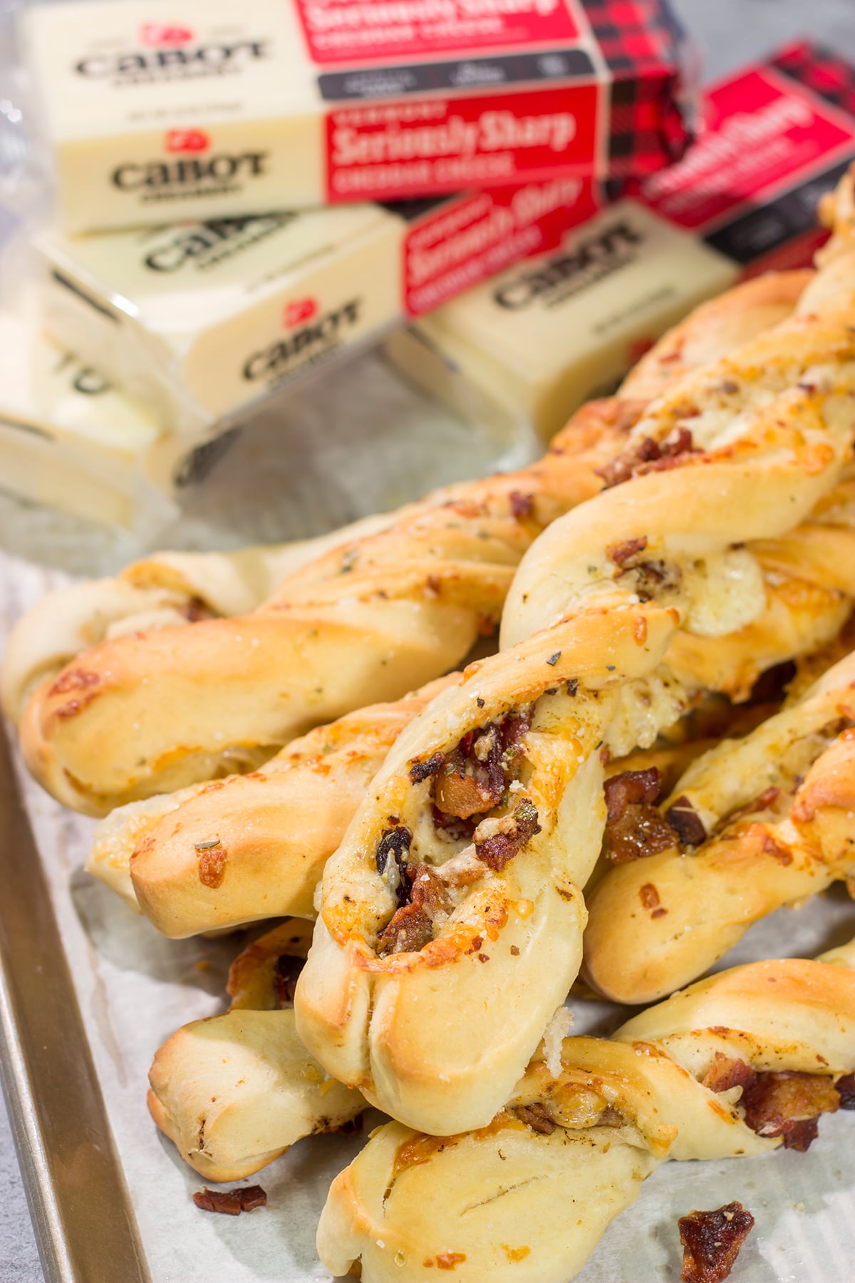 These Cheesy Bacon Breadsticks are proof that bacon and cheese make everything better! These breadsticks are great served as an appetizer or side dish. Enjoy!