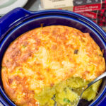 This Cheesy Spoon Bread is a cross between a souffle and cornbread. It's an easy dinner side dish that is packed with cheesy flavor!