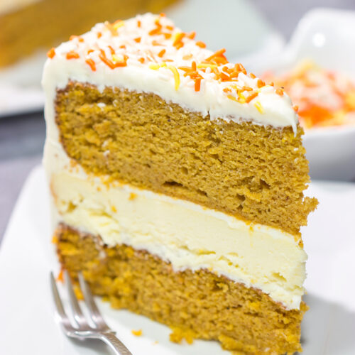 This Pumpkin Spice Cheesecake Cake features a layer of cheesecake sandwiched in between 2 layers of pumpkin spice cake. It's a delicious autumn dessert!