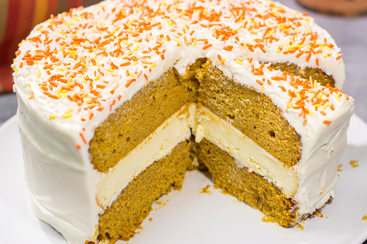 This Pumpkin Spice Cheesecake Cake features a layer of cheesecake sandwiched in between 2 layers of pumpkin spice cake. It's a delicious autumn dessert!