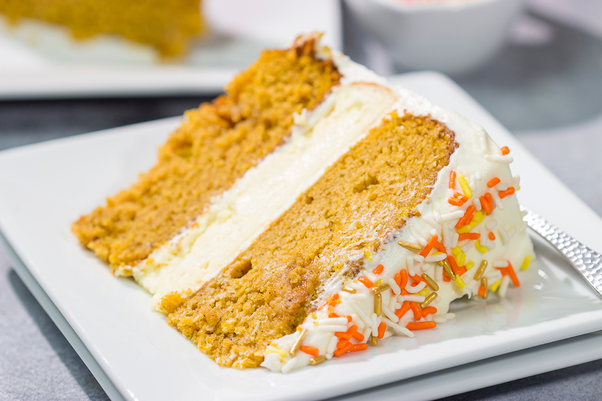 This Pumpkin Spice Cheesecake Cake features a layer of cheesecake sandwiched in between 2 layers of pumpkin spice cake. It's a delicious autumn dessert!
