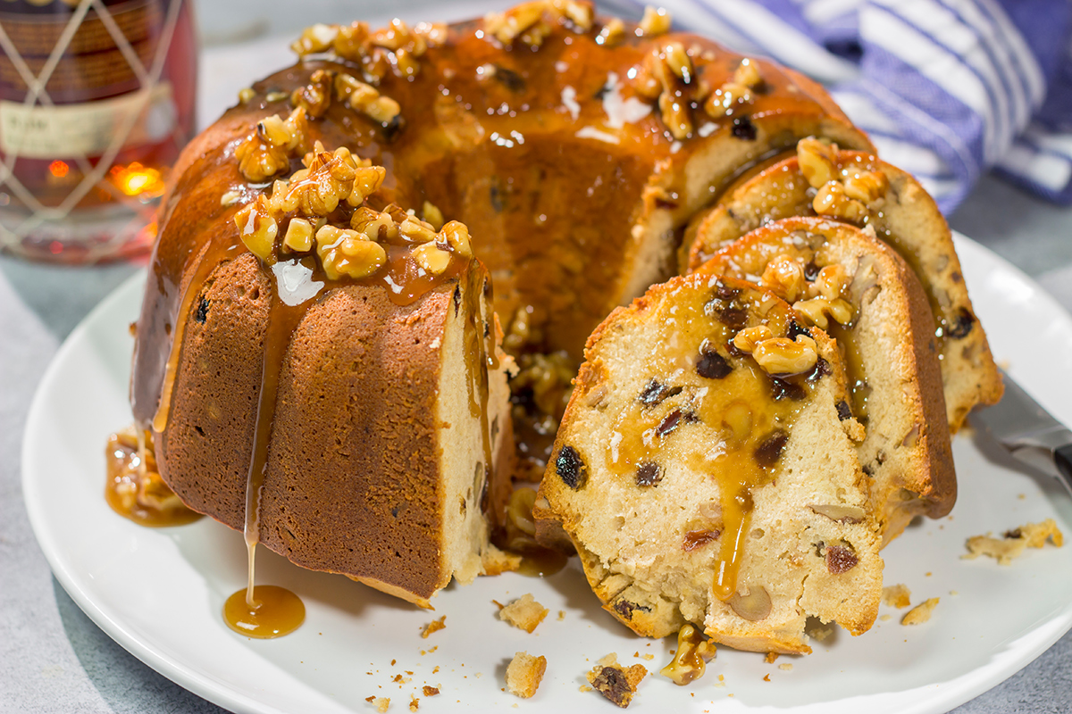 This Rum Raisin Pound Cake features a buttery cake studded with raisins and chopped walnuts. For extra flavor, a warm rum sauce gets poured over the cake before serving.
