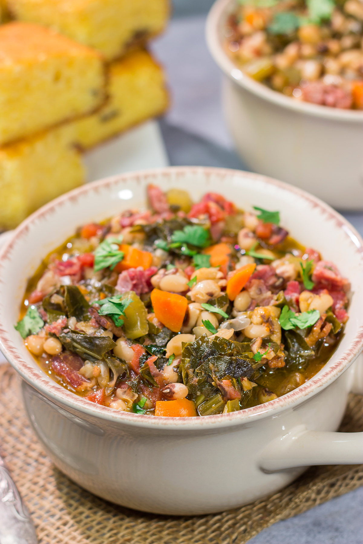 A bowl of this Black Eyed Pea Soup is sure to bring good luck - and it's delicious! Serve this hearty soup with a hunk of warm, buttered cornbread for the ultimate cozy meal.