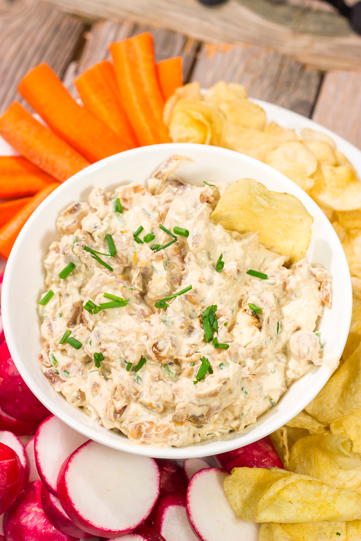 This Caramelized Onion Dip is the perfect party appetizer! Grab some crackers, veggies and chips and get ready to dig into this classic dip!
