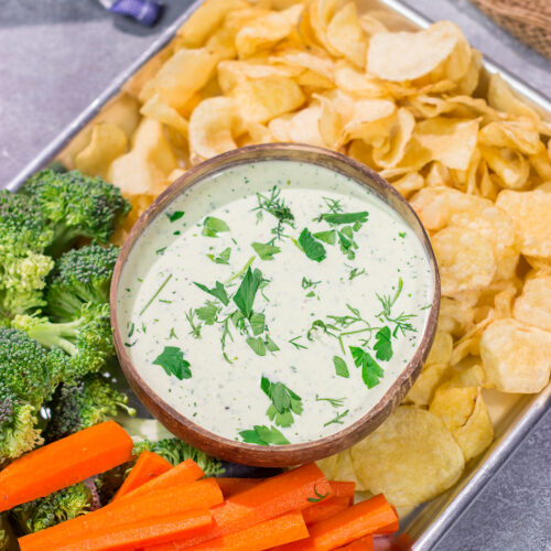 This Goat Cheese Ranch Dip is an easy and delicious party appetizer recipe! It can also be turned into a salad dressing. It's packed with flavor no matter how you serve it!