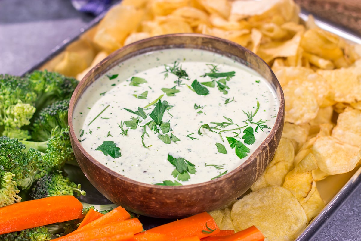 This Goat Cheese Ranch Dip is an easy and delicious party appetizer recipe! It can also be turned into a salad dressing. It's packed with flavor no matter how you serve it!