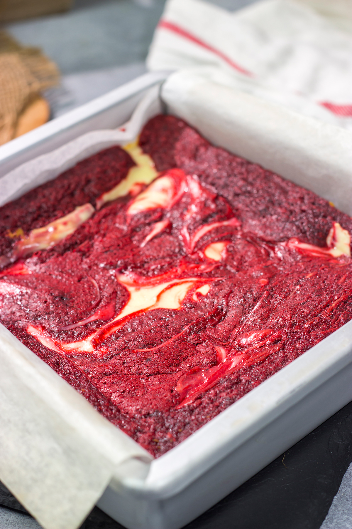 These Red Velvet Cheesecake Bars feature a chocolate brownie base topping with a layer of creamy cheesecake. They're perfect for Valentine's Day...or any day!