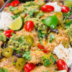 Skip the chips! These Toasted Ravioli Nachos feature all of your favorite nacho toppings on top of toasted ravioli. Go ahead and make an extra batch...you'll need it!