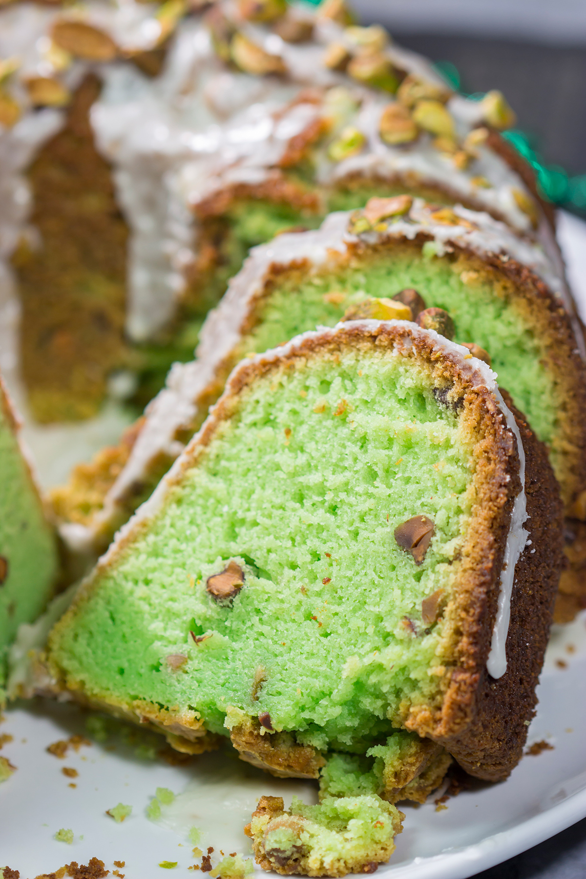 Featuring a mild nutty flavor, this homemade Pistachio Bundt Cake is a tasty dessert recipe. Top with a simple glaze and chopped pistachios for a mouthwatering appearance!