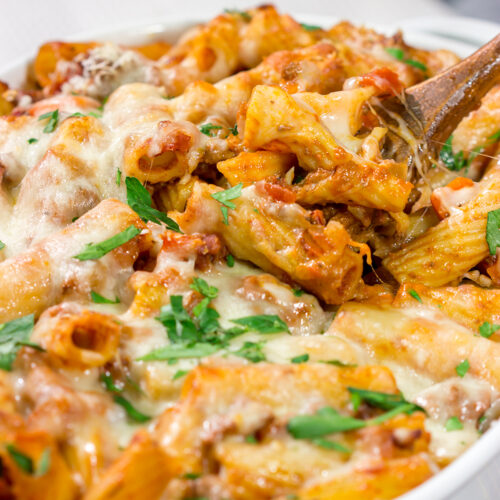 This Baked Pasta Bolognese is the ultimate comfort food! The homemade Bolognese sauce is layered with pasta and cheese to create a delicious recipe that's sure to become a family favorite!
