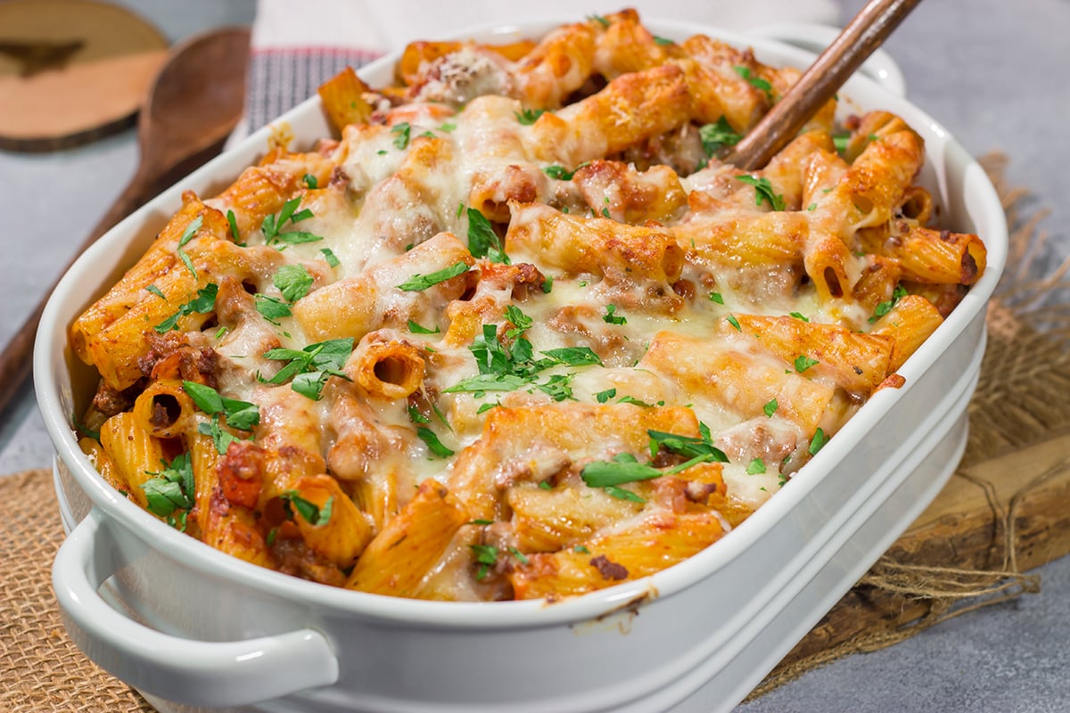 This Baked Pasta Bolognese is the ultimate comfort food! The homemade Bolognese sauce is layered with pasta and cheese to create a delicious recipe that's sure to become a family favorite!