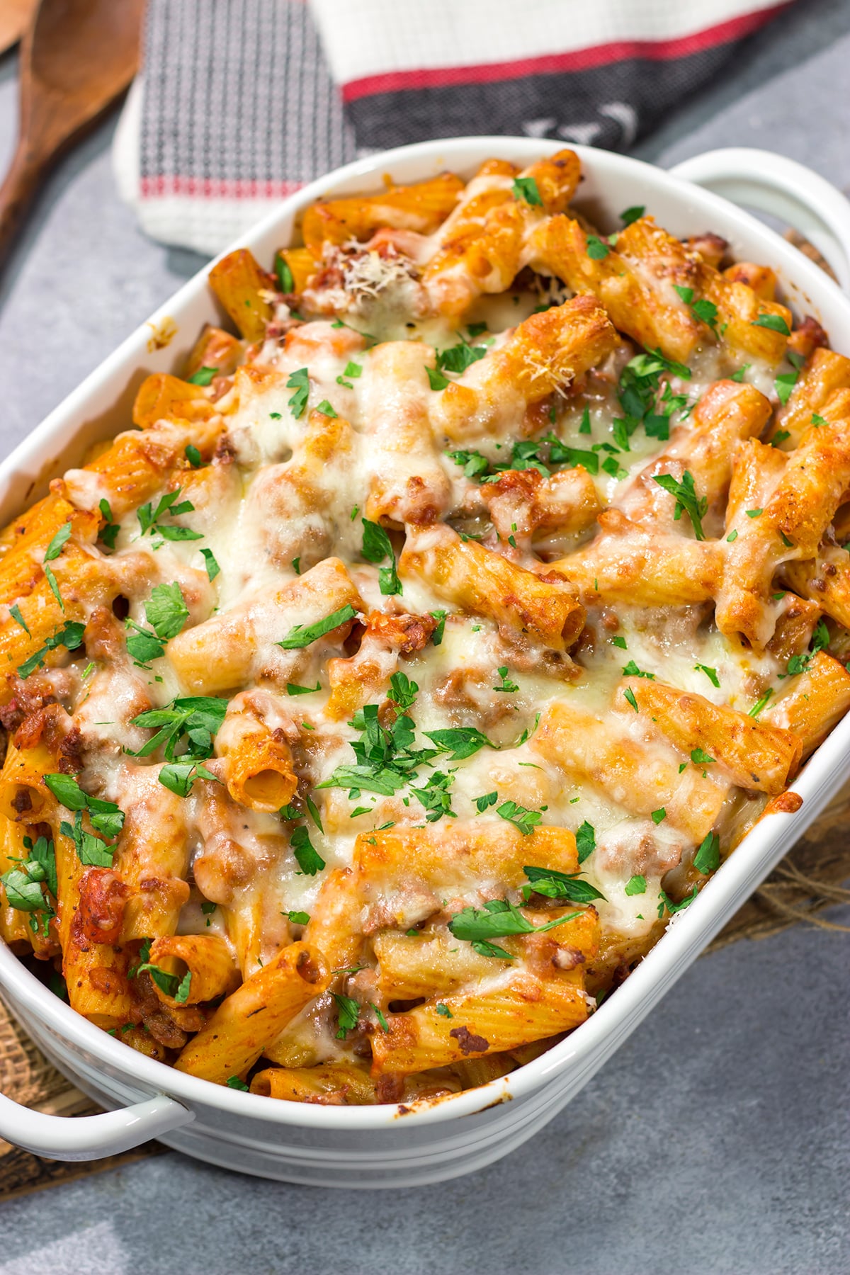 This Baked Pasta Bolognese is the ultimate comfort food! The homemade Bolognese sauce is layered with pasta and cheese to create a delicious recipe that's sure to become a family favorite!