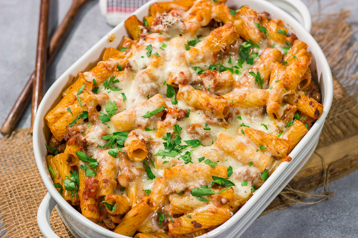This Baked Pasta Bolognese is the ultimate comfort food! The homemade Bolognese sauce is layered with pasta and cheese to create a delicious recipe that's sure to become a family favorite!