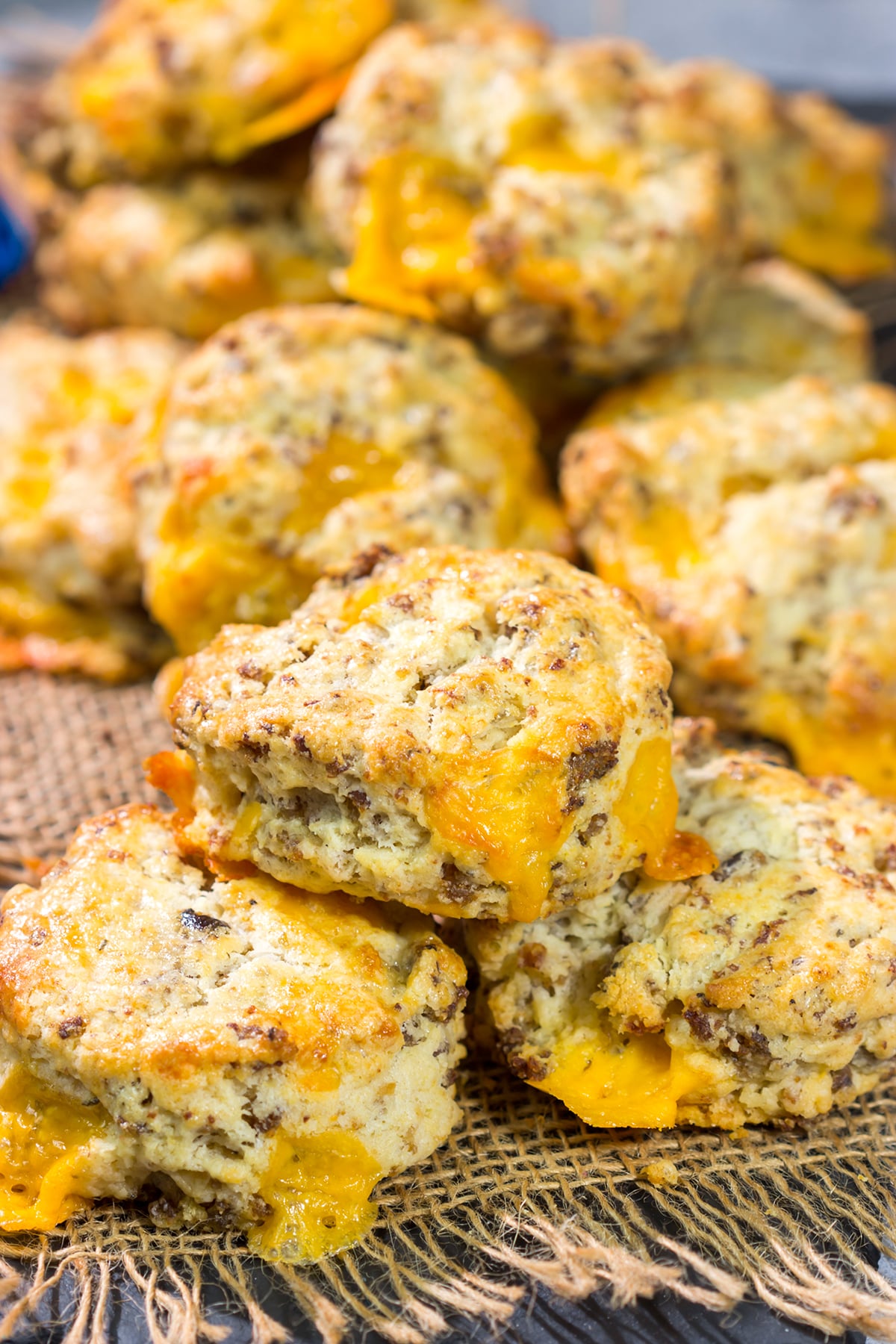 Instead of putting sausage and cheese on a biscuit, put sausage and cheese IN a biscuit! These Cheesy Sausage Biscuits are the perfect savory breakfast for a cold morning.