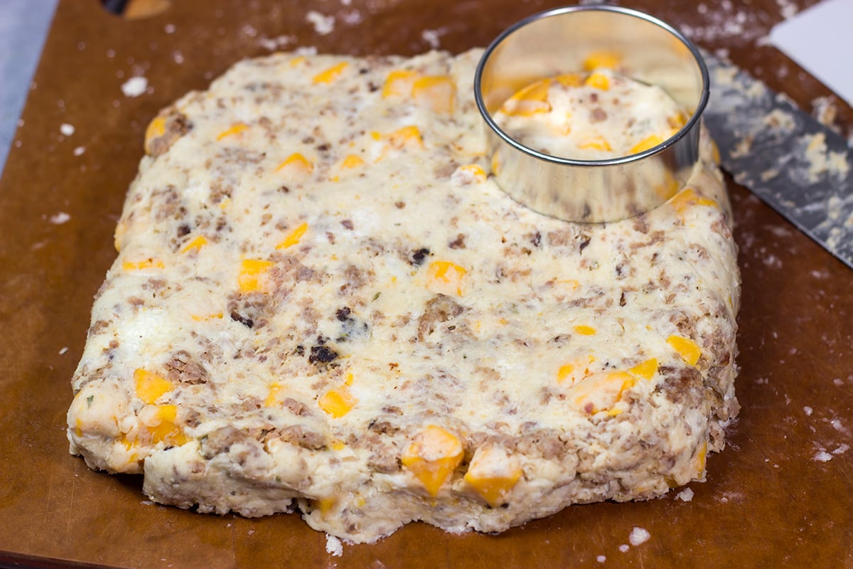 Instead of putting sausage and cheese on a biscuit, put sausage and cheese IN a biscuit! These Cheesy Sausage Biscuits are the perfect savory breakfast for a cold morning.