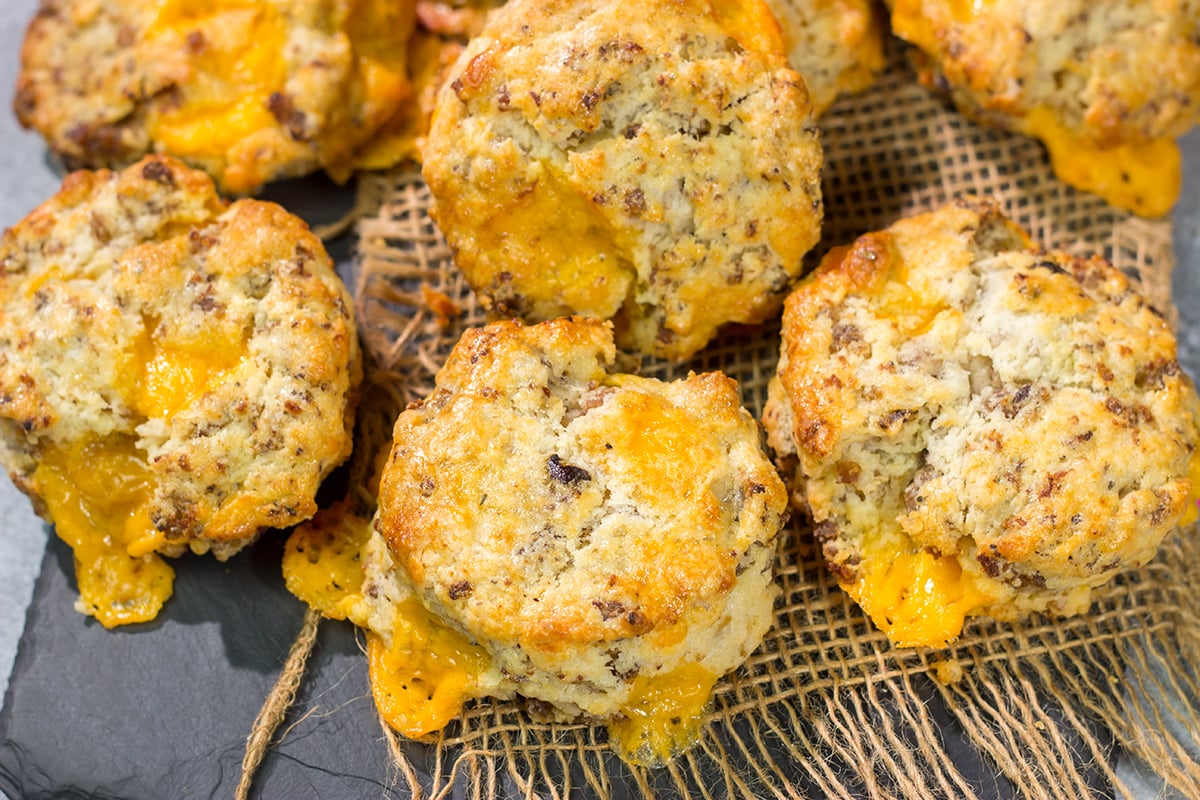 Instead of putting sausage and cheese on a biscuit, put sausage and cheese IN a biscuit! These Cheesy Sausage Biscuits are the perfect savory breakfast for a cold morning.