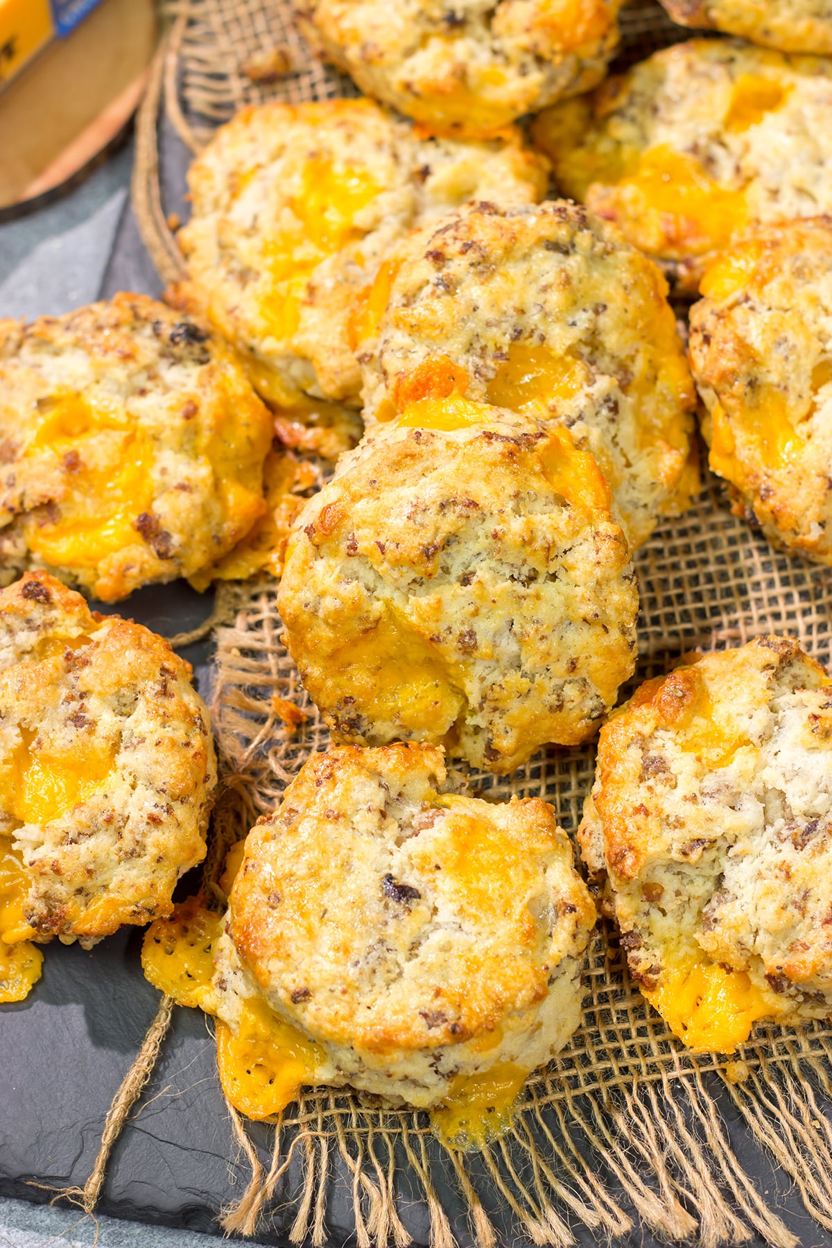 Instead of putting sausage and cheese on a biscuit, put sausage and cheese IN a biscuit! These Cheesy Sausage Biscuits are the perfect savory breakfast for a cold morning.