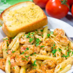 This Copycat Chili's Cajun Shrimp Pasta features creamy alfredo sauce tossed with succulent Cajun shrimp. It's delicious - and easy enough for a weeknight meal!