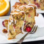 This Cranberry Pecan Coffee Cake is packed with pecans and fresh cranberries, and it's topped with a brown sugar streusel. This treat is perfect for holiday brunch!