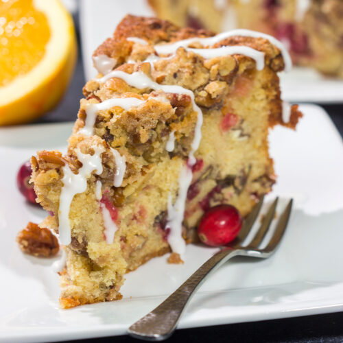 This Cranberry Pecan Coffee Cake is packed with pecans and fresh cranberries, and it's topped with a brown sugar streusel. This treat is perfect for holiday brunch!
