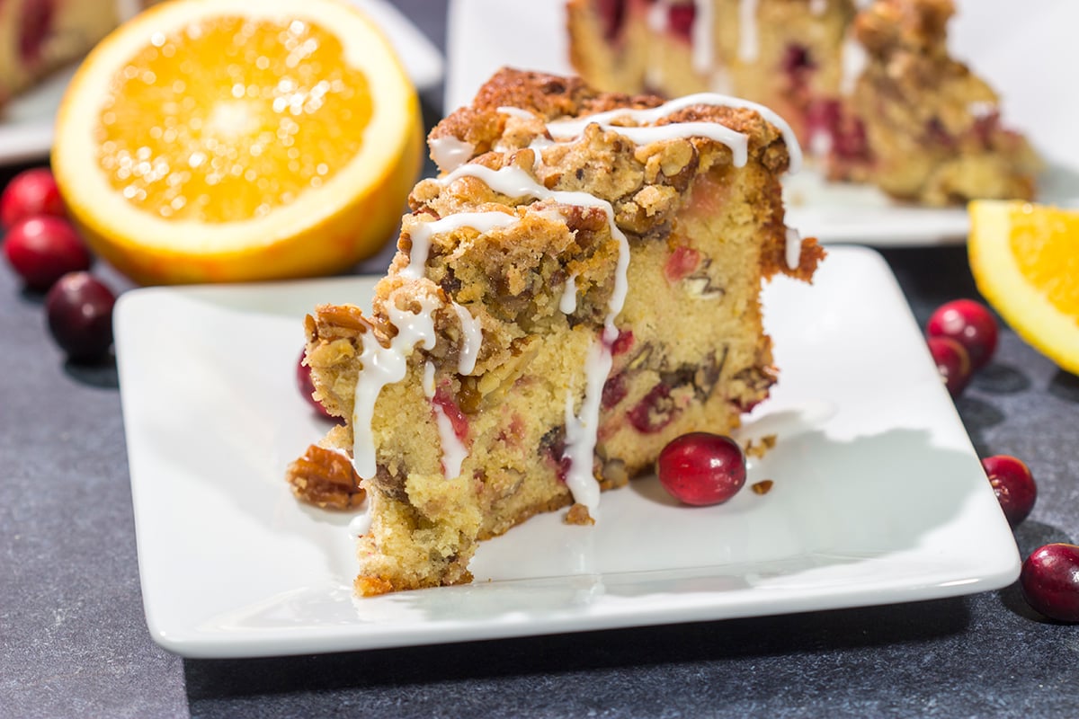 This Cranberry Pecan Coffee Cake is packed with pecans and fresh cranberries, and it's topped with a brown sugar streusel. This treat is perfect for holiday brunch!
