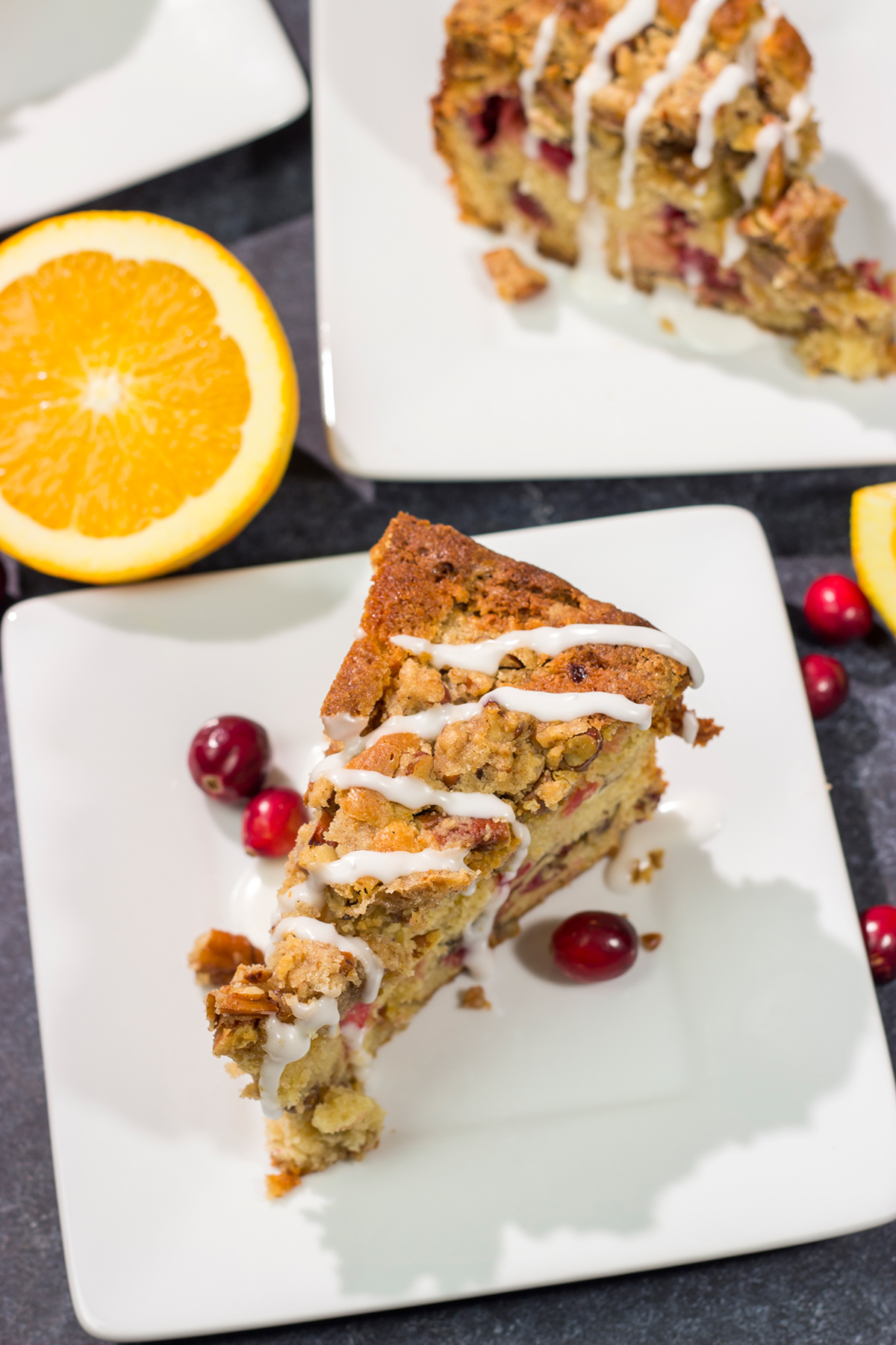 This Cranberry Pecan Coffee Cake is packed with pecans and fresh cranberries, and it's topped with a brown sugar streusel. This treat is perfect for holiday brunch!