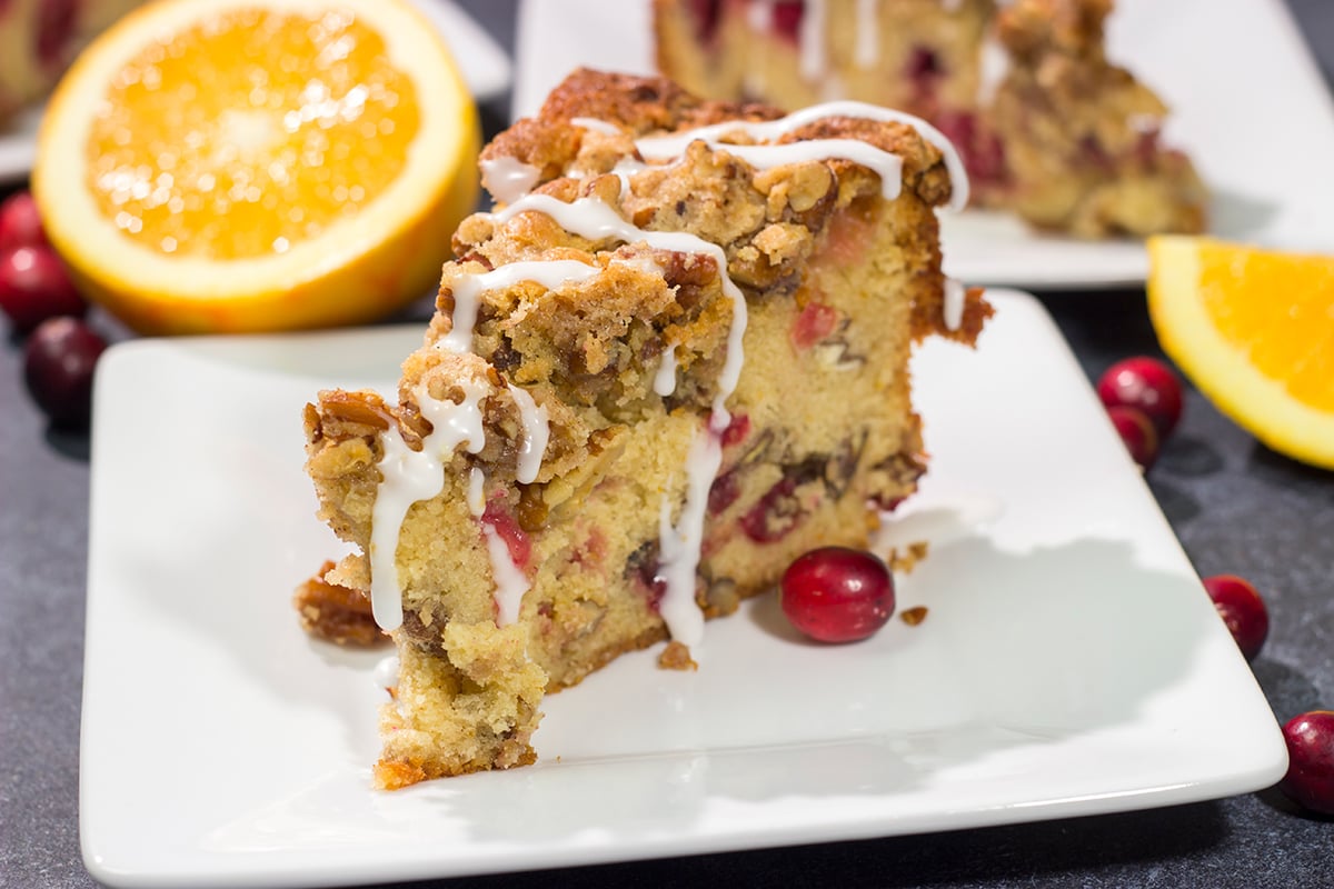 This Cranberry Pecan Coffee Cake is packed with pecans and fresh cranberries, and it's topped with a brown sugar streusel. This treat is perfect for holiday brunch!