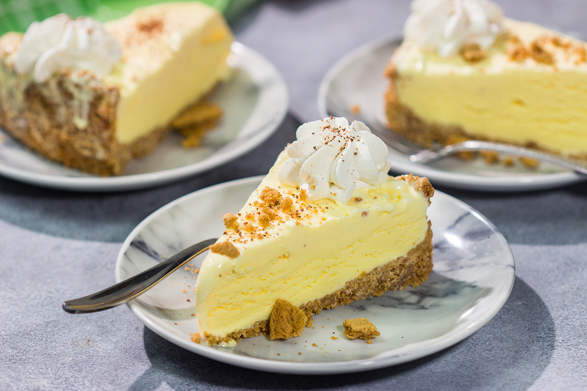 Who says ice cream is only for warm weather? This Eggnog Ice Cream Pie features creamy ice cream in a gingersnap cookie crust - it's a delicious treat for the holiday season!