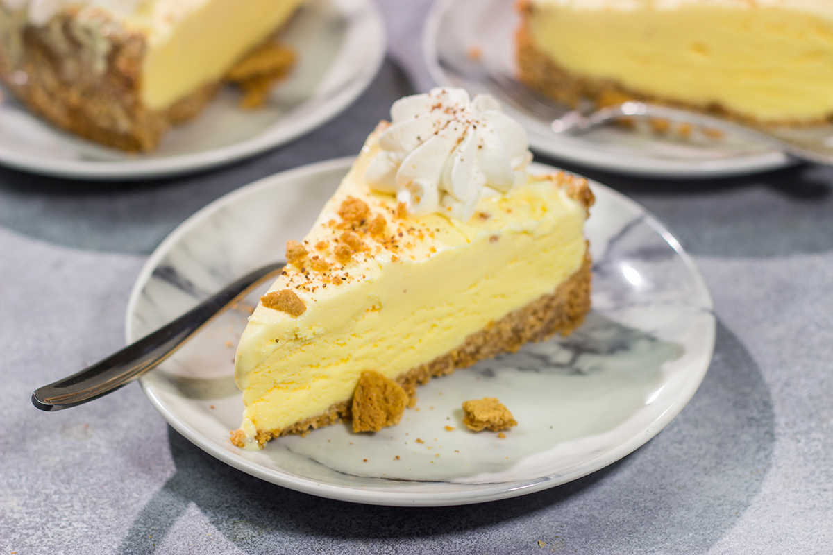 Who says ice cream is only for warm weather? This Eggnog Ice Cream Pie features creamy ice cream in a gingersnap cookie crust - it's a delicious treat for the holiday season!