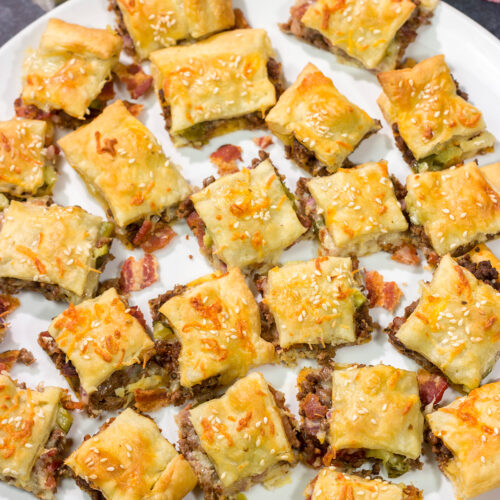 Sandwiched between two layers of puff pastry, these tasty Bacon Cheeseburger Bites are the perfect party appetizer!
